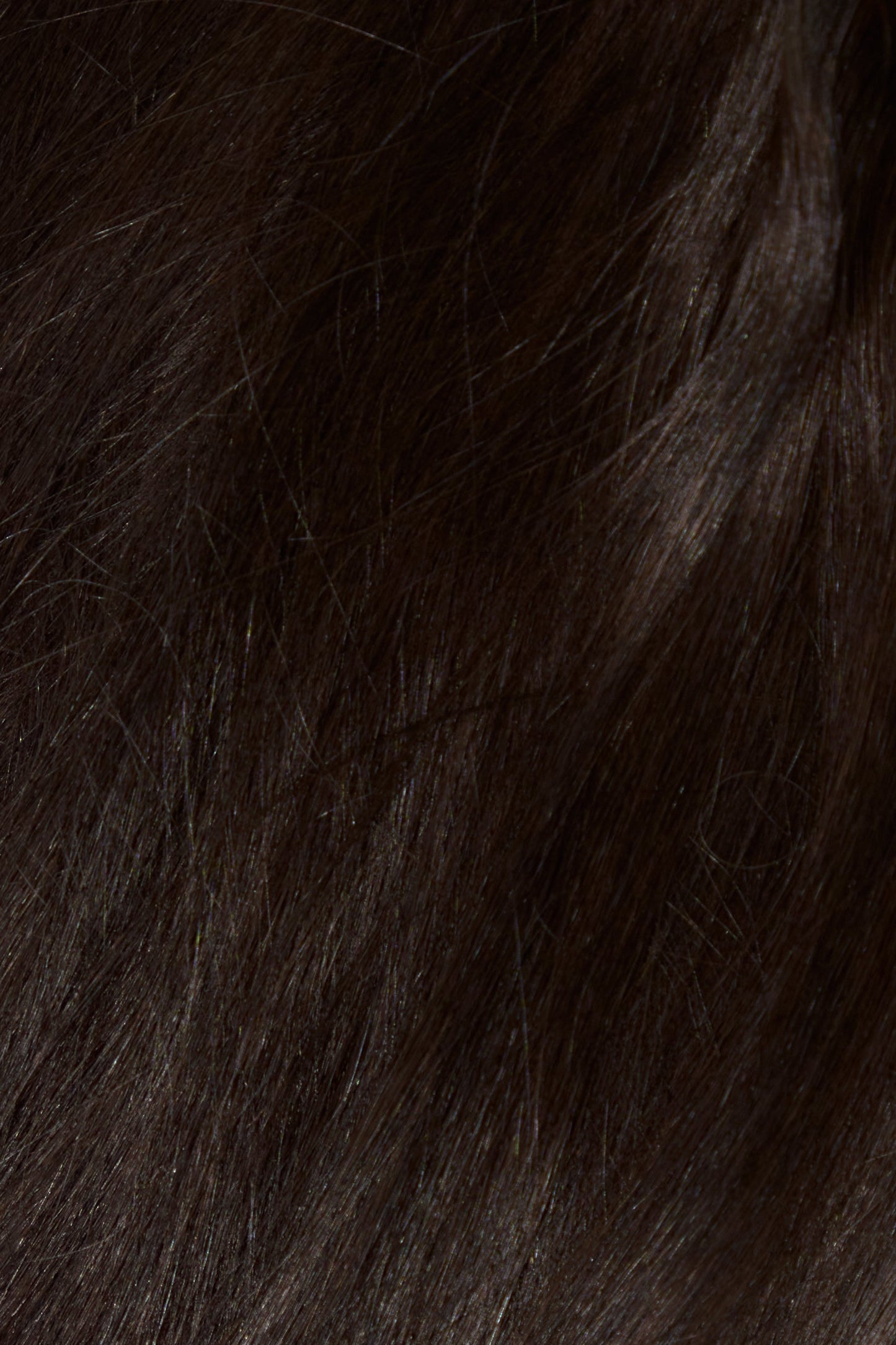 Close-up of thick, dark brown hair extension bundle by 1010 Extension ideal for custom installs and colouring