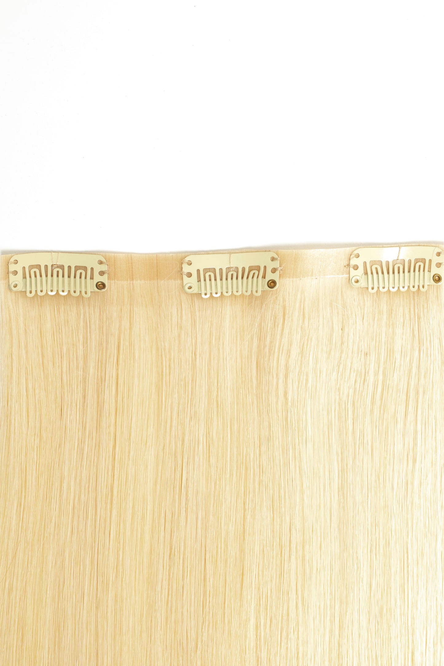 Sleek and shiny bright blonde clip-in extensions made from 100% virgin human hair