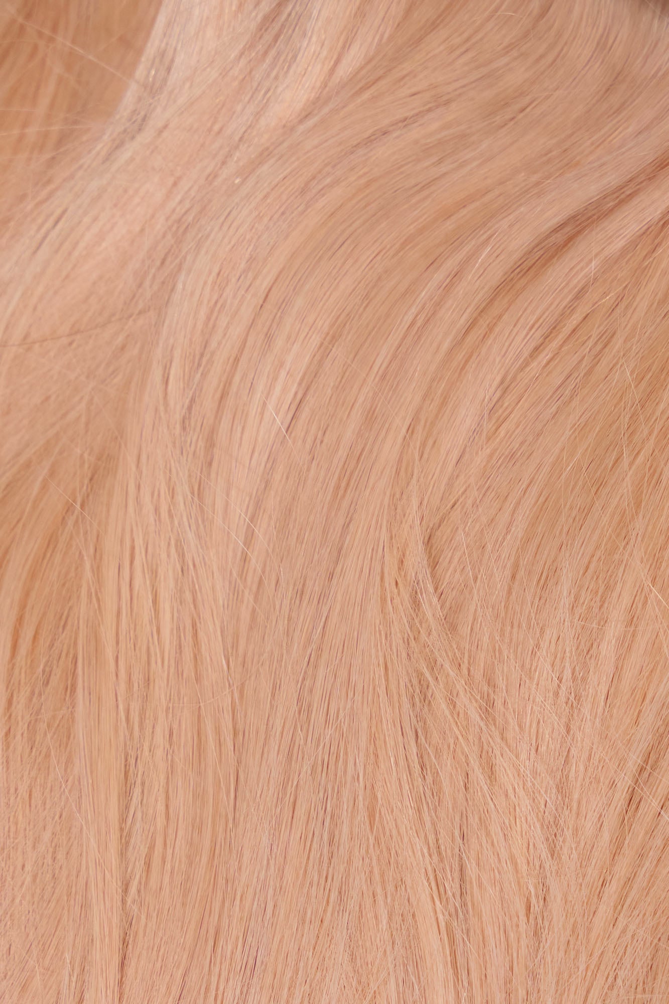 Elegant low ponytail in warm blonde using Remy hair extension from 1010 Extensions