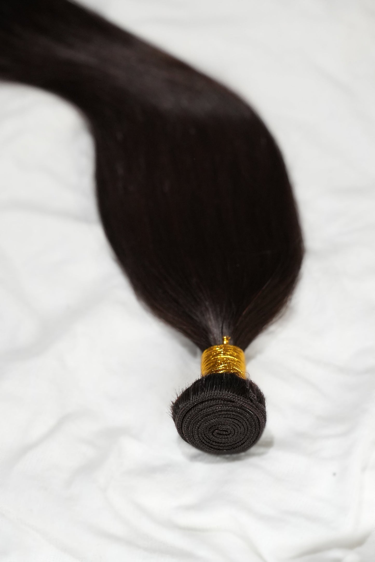 Silky dark brown Remy human hair bundle offering longevity and minimal shedding from 1010 Extensions