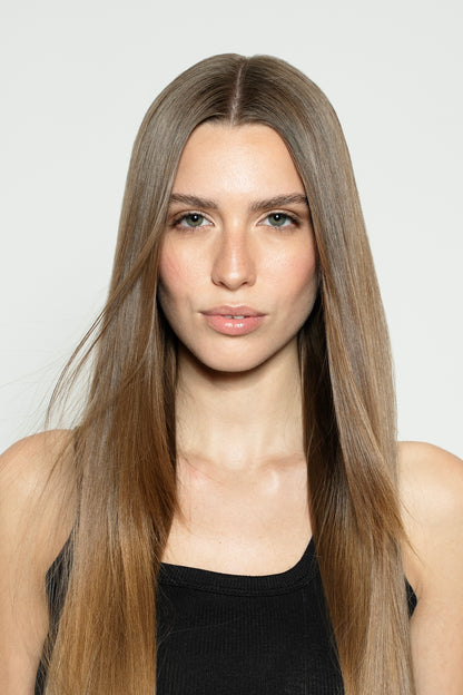 Model with light brown clip-in hair extensions for a soft, natural brunette look