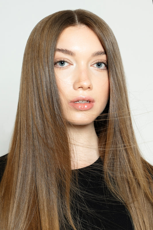 Model styled with warm brown human hair clip-ins for added depth and fullness