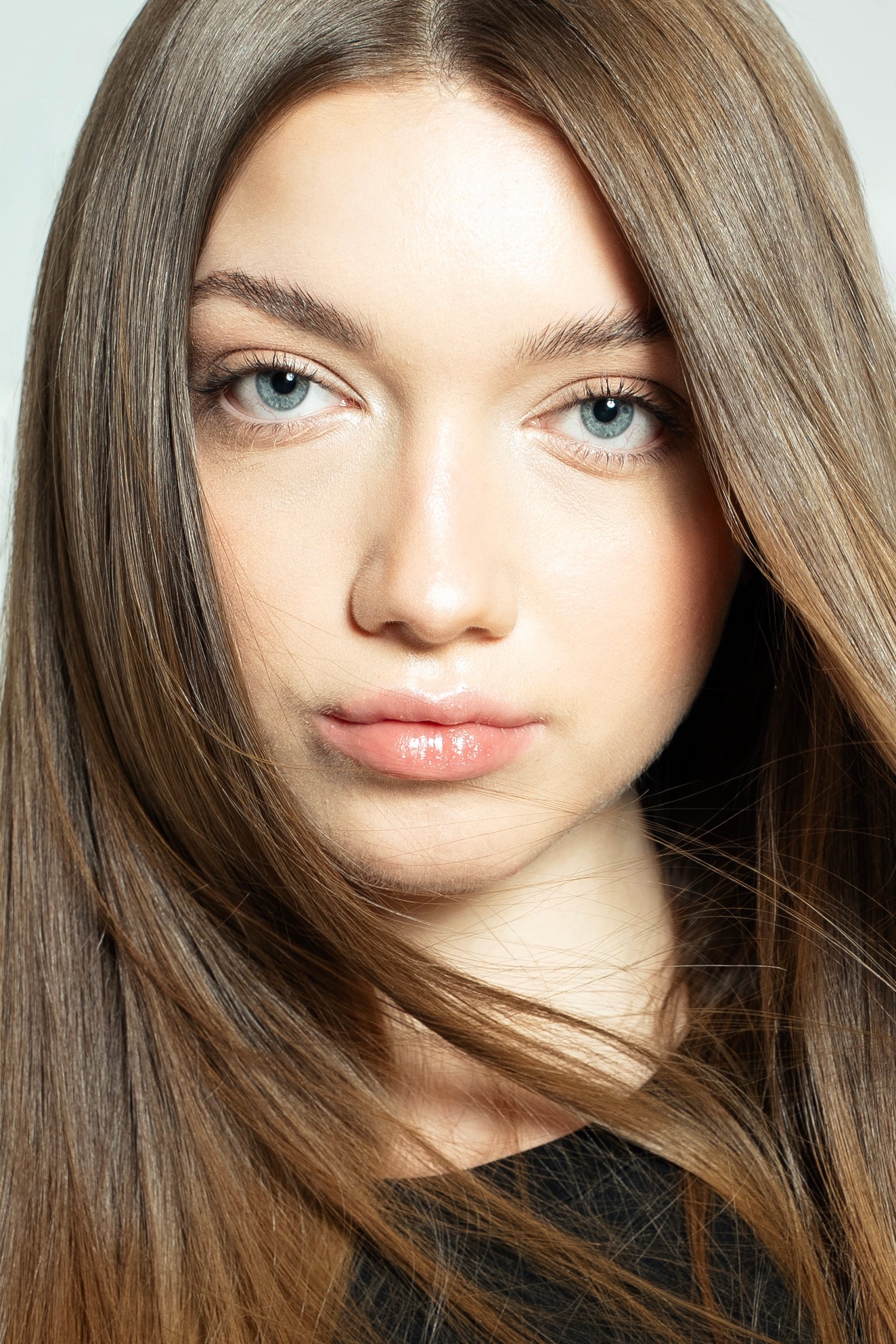 Soft, natural-looking clip-in extensions in warm brown shade for everyday wear
