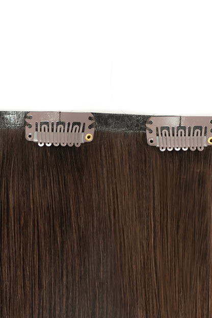Dark brown clip-in hair extensions from 1010 Extensions for a bold, voluminous look