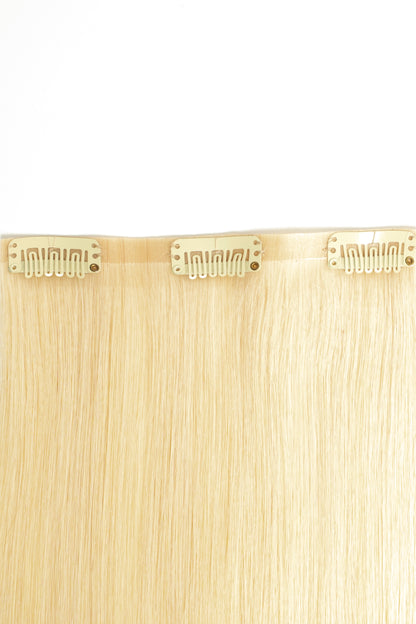 Sleek and shiny bright blonde clip-in extensions made from 100% virgin human hair