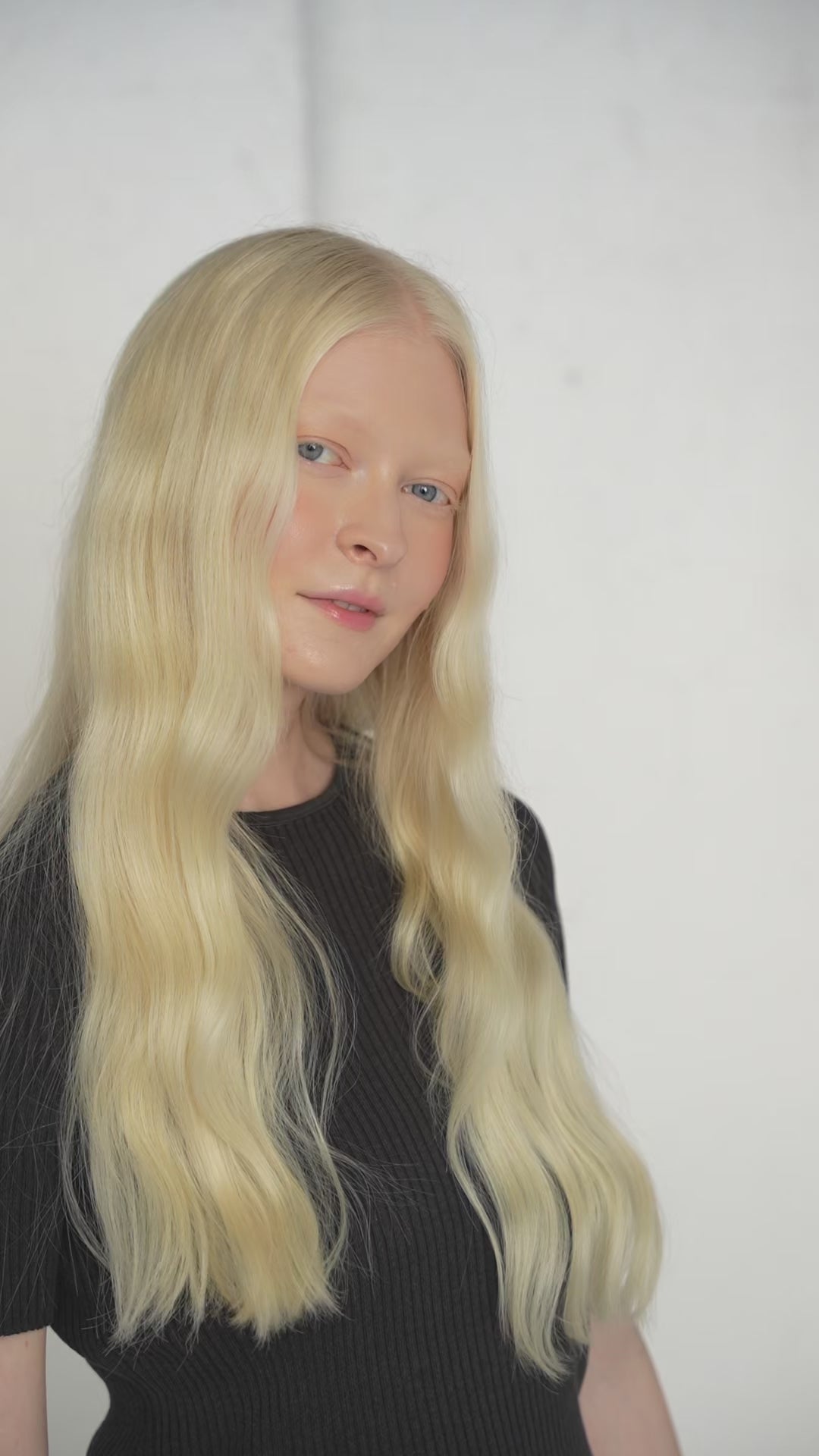 Model wearing 7-piece bright blonde Remy clip-ins with a seamless, natural blend