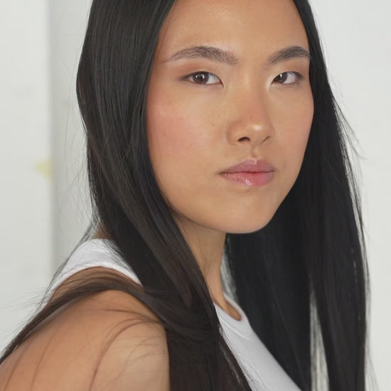 Glossy noir black 7-piece Remy clip-in set for a sleek, bold look by 1010 Extensions